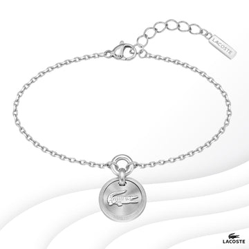 Ατσάλινο βραχιόλι Lacoste 2040404 σε ασημί χρώμα με στρογγυλό κρεμαστό στοιχείο και ρυθμιζόμενο κούμπωμα από ανοξείδωτο ατσάλι.